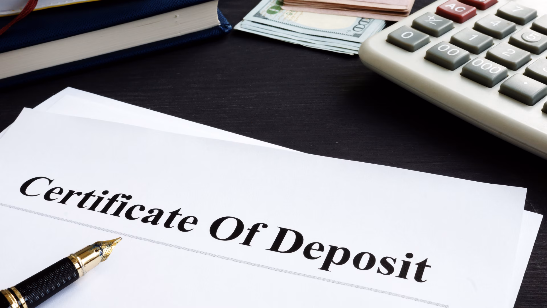 Certificates & IRAs - Certificate of Deposit Certificate of Deposit paperwork with a pen on it.